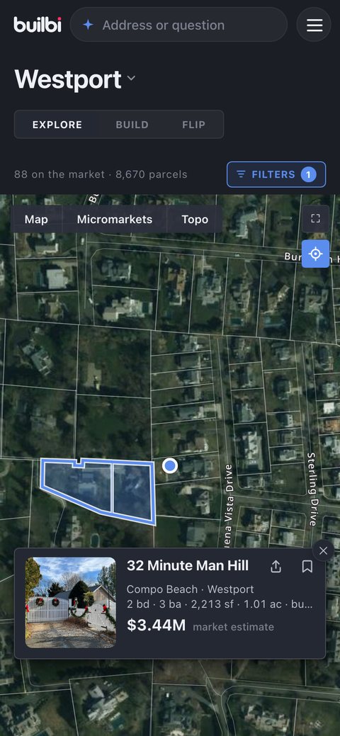 A tap on the house next door opens its card: 32 Minute Man Hill, Compo Beach, two bedrooms, 2,213 square feet on an acre, a $3.44M market estimate.